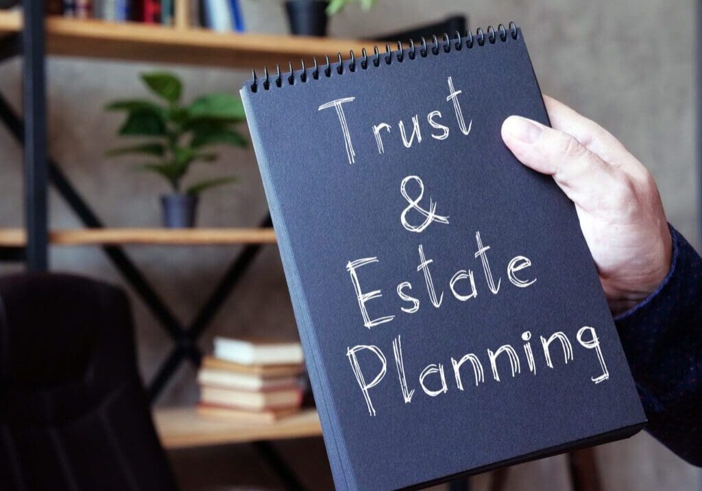 Trust and Estate Planning is shown on a conceptual business photo